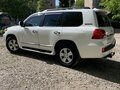 2012 Toyota Land Cruiser 200 Series Рестайлинг 1, белый, 4600000 рублей - вид 4