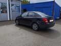 2012 Chevrolet Aveo II, чёрный, 700000 рублей - вид 4
