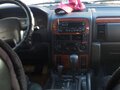 1999 Jeep Grand Cherokee II (WJ), чёрный - вид 4