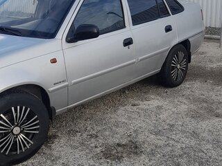 2011 Daewoo Nexia I Рестайлинг, серебристый, 210000 рублей, вид 2