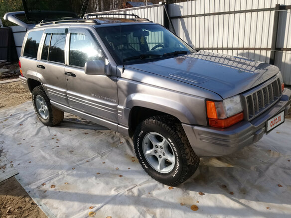 1998 Jeep Grand Cherokee I (ZJ) Рестайлинг, серебристый - вид 1