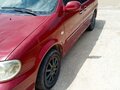 2005 Kia Carnival I Рестайлинг, красный, 550000 рублей - вид 2