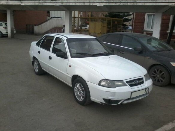 2010 Daewoo Nexia I Рестайлинг, белый - вид 4