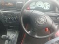 2002 Toyota Corolla Fielder IX (E120, E130), красный, 450000 рублей - вид 7