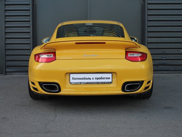 2009 Porsche 911 Turbo VI (997) Рестайлинг, жёлтый - вид 3