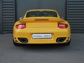 2009 Porsche 911 Turbo VI (997) Рестайлинг, жёлтый - вид 3