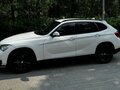 2014 BMW X1 18i I (E84) Рестайлинг, белый, 1450000 рублей - вид 1