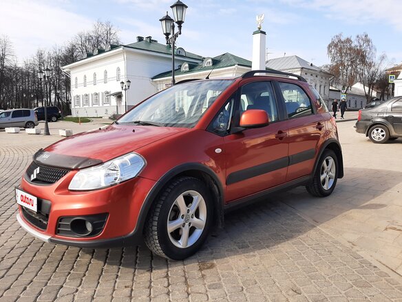 2011 Suzuki SX4 I (Classic) Рестайлинг, оранжевый