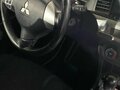 2011 Mitsubishi Lancer X Рестайлинг, чёрный, 870000 рублей - вид 9