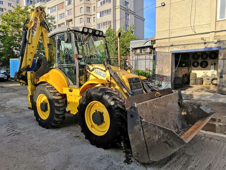2005 New Holland B115B, жёлтый, 4500000 рублей, вид 1