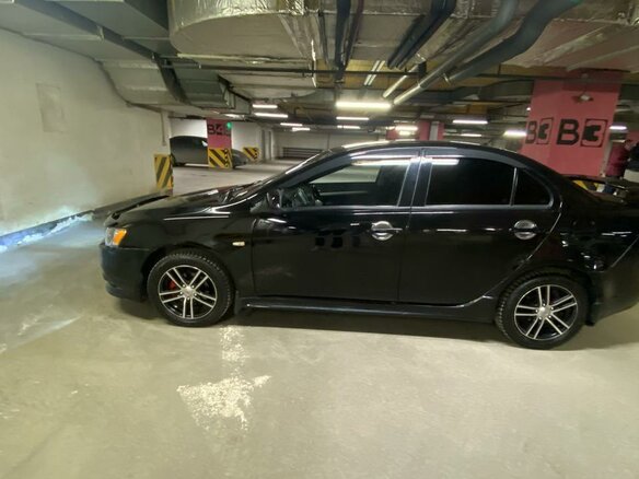 2011 Mitsubishi Lancer X Рестайлинг, чёрный, 870000 рублей - вид 1