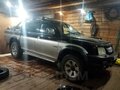 2006 Mitsubishi L200 III Рестайлинг, чёрный, 750000 рублей - вид 1