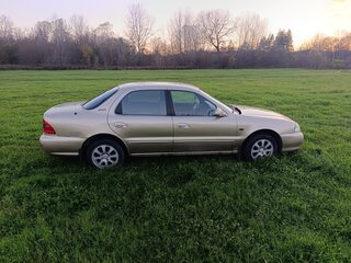 2001 Kia Clarus II, бежевый, 300000 рублей, вид 4