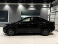 2010 Ford Focus II Рестайлинг, чёрный - вид 2