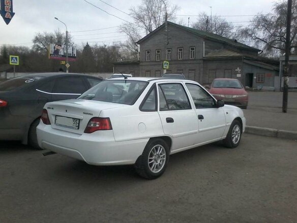 2010 Daewoo Nexia I Рестайлинг, белый - вид 2