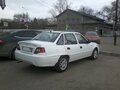 2010 Daewoo Nexia I Рестайлинг, белый - вид 2