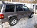 1998 Jeep Grand Cherokee I (ZJ) Рестайлинг, серебристый - вид 4