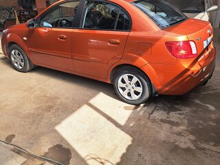 2010 Kia Rio II Рестайлинг, оранжевый, 550000 рублей, вид 2