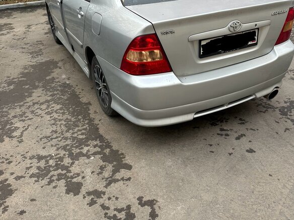 2004 Toyota Corolla IX (E120, E130), серебристый - вид 5