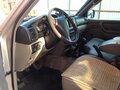 2003 Toyota Land Cruiser 105 100 Series Рестайлинг 1, серебристый - вид 2