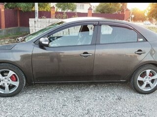 2010 Kia Cerato 5-speed II, коричневый, 505000 рублей, вид 4