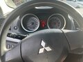 2008 Mitsubishi Lancer X, чёрный, 620000 рублей - вид 8
