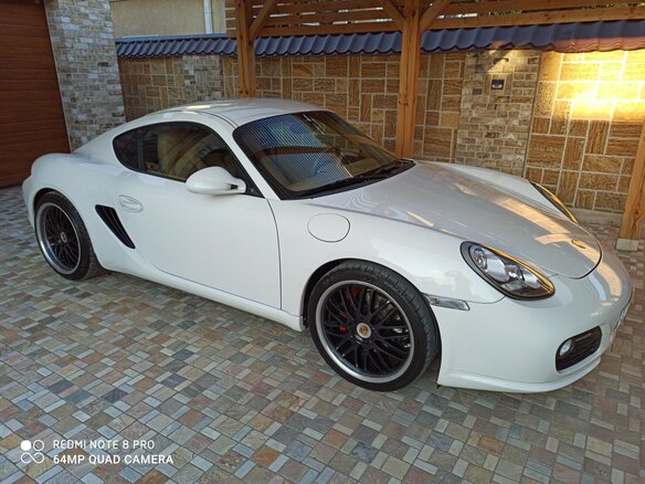 2009 Porsche Cayman I (987) Рестайлинг, белый - вид 1