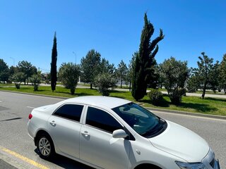 2010 Toyota Corolla X (E140, E150), белый, 1055000 рублей, вид 5