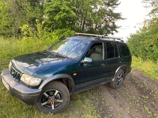 2004 Kia Sportage Grand I, зелёный, 525000 рублей, вид 1
