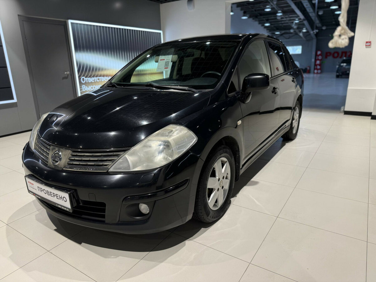 Открыть фотографии: Nissan Tiida I