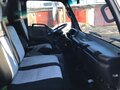 2011 Isuzu Elf (N-series), белый, 1450000 рублей - вид 6