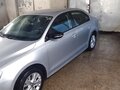 2014 Volkswagen Jetta VI Рестайлинг, серебристый, 850000 рублей - вид 1