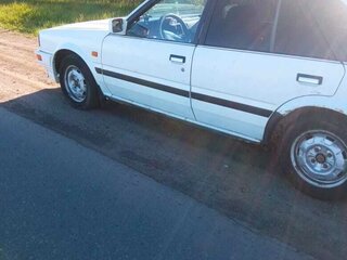 1986 Nissan Bluebird VIII (T12, T72), белый, 200000 рублей, вид 2