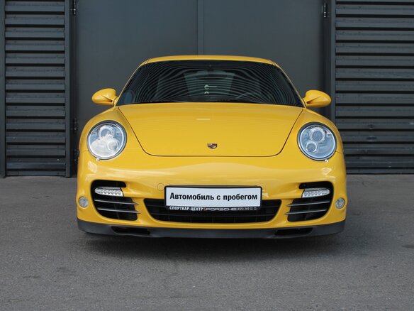 2009 Porsche 911 Turbo VI (997) Рестайлинг, жёлтый - вид 1