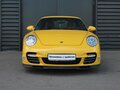 2009 Porsche 911 Turbo VI (997) Рестайлинг, жёлтый - вид 1