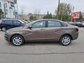 2026 Lada (ВАЗ) Vesta I Рестайлинг (NG), коричневый, 1962900 рублей - вид 2