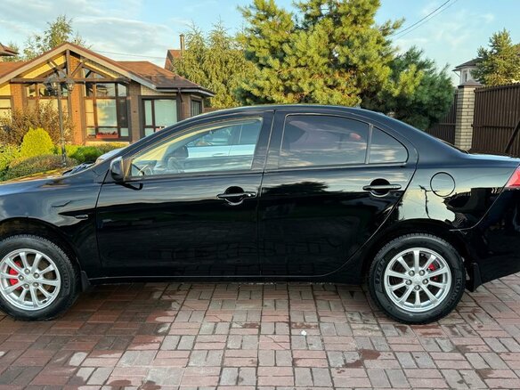 2012 Mitsubishi Lancer X Рестайлинг, чёрный, 669000 рублей - вид 8