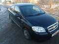 2011 Chevrolet Aveo I Рестайлинг, чёрный - вид 1