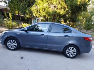 2012 Kia Rio 4-speed III, серый, 819000 рублей, вид 4