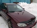 2006 Kia Spectra I Рестайлинг 2, пурпурный - вид 1