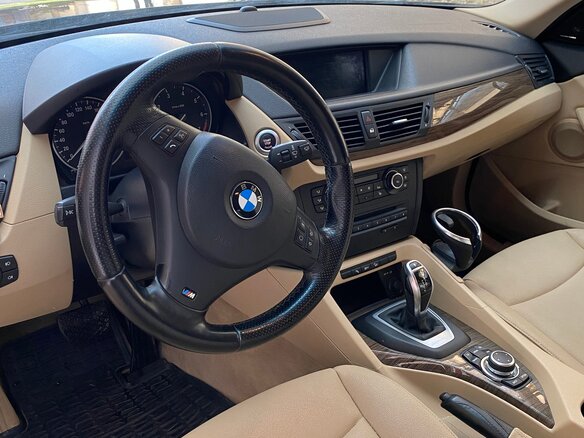 2011 BMW X1 20i I (E84), коричневый, 1850000 рублей - вид 4