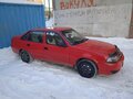 2010 Daewoo Nexia I Рестайлинг, красный - вид 3