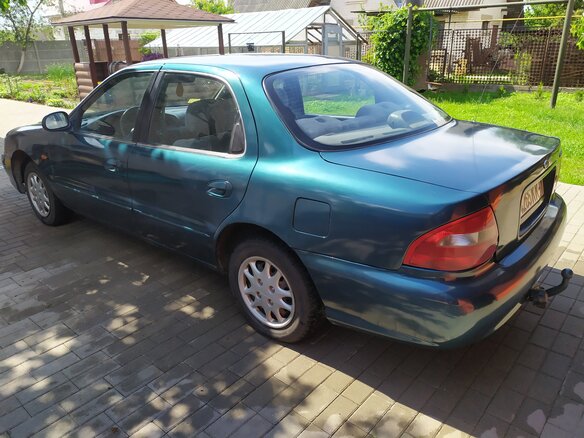 1999 Kia Clarus II, зелёный, 104437 рублей - вид 4