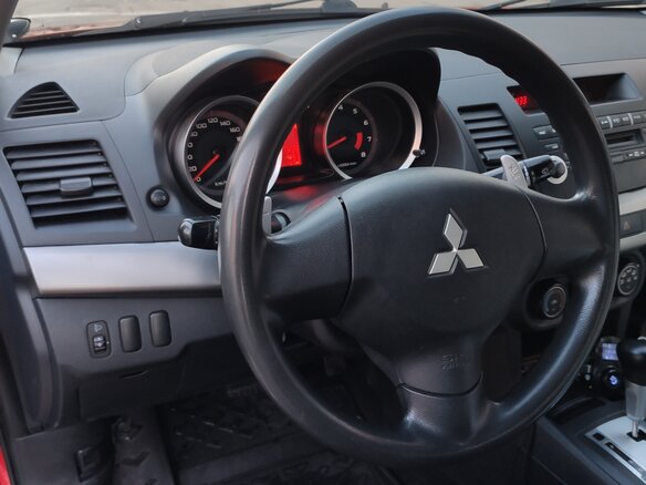 2008 Mitsubishi Lancer X, красный - вид 4