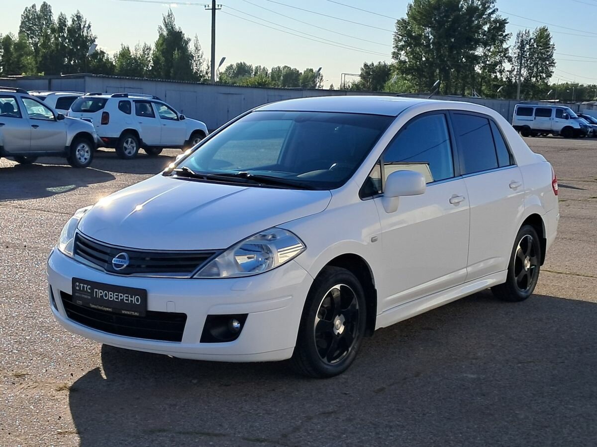 Открыть фотографии: Nissan Tiida I Рестайлинг