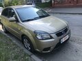 2010 Kia Rio II Рестайлинг, золотистый, 750000 рублей