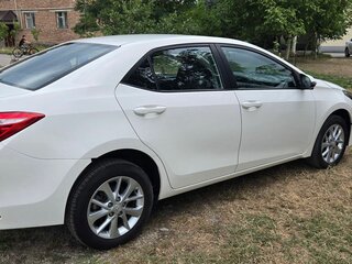 2014 Toyota Corolla XI (E160, E170, E180), белый, 1350000 рублей, вид 5