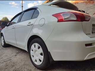 2009 Mitsubishi Lancer X, белый, 655000 рублей, вид 2