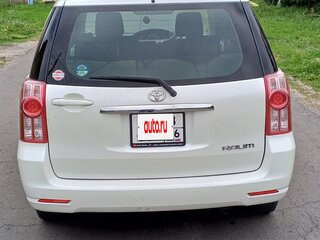 2010 Toyota Raum II, белый, 1800000 рублей, вид 2