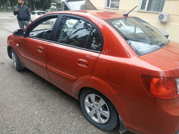 2010 Kia Rio II Рестайлинг, красный - вид 1